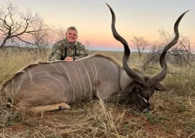 Photo of Hendrik with a large kudu prize.