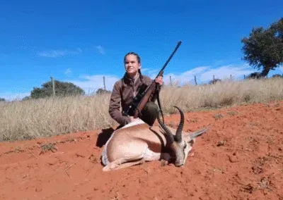 Photo of a 12-year-old hunter with her prize springbuck.